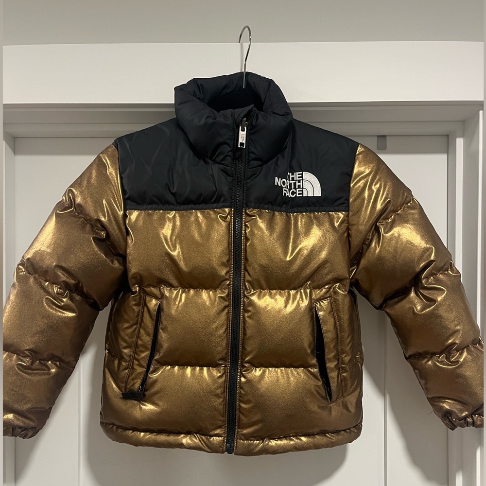 The North Face Kids' 1996 Retro Nuptse Jacket in metallic copper. Size: Kids 7/8